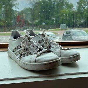 Adidas cheetah print Superstars.